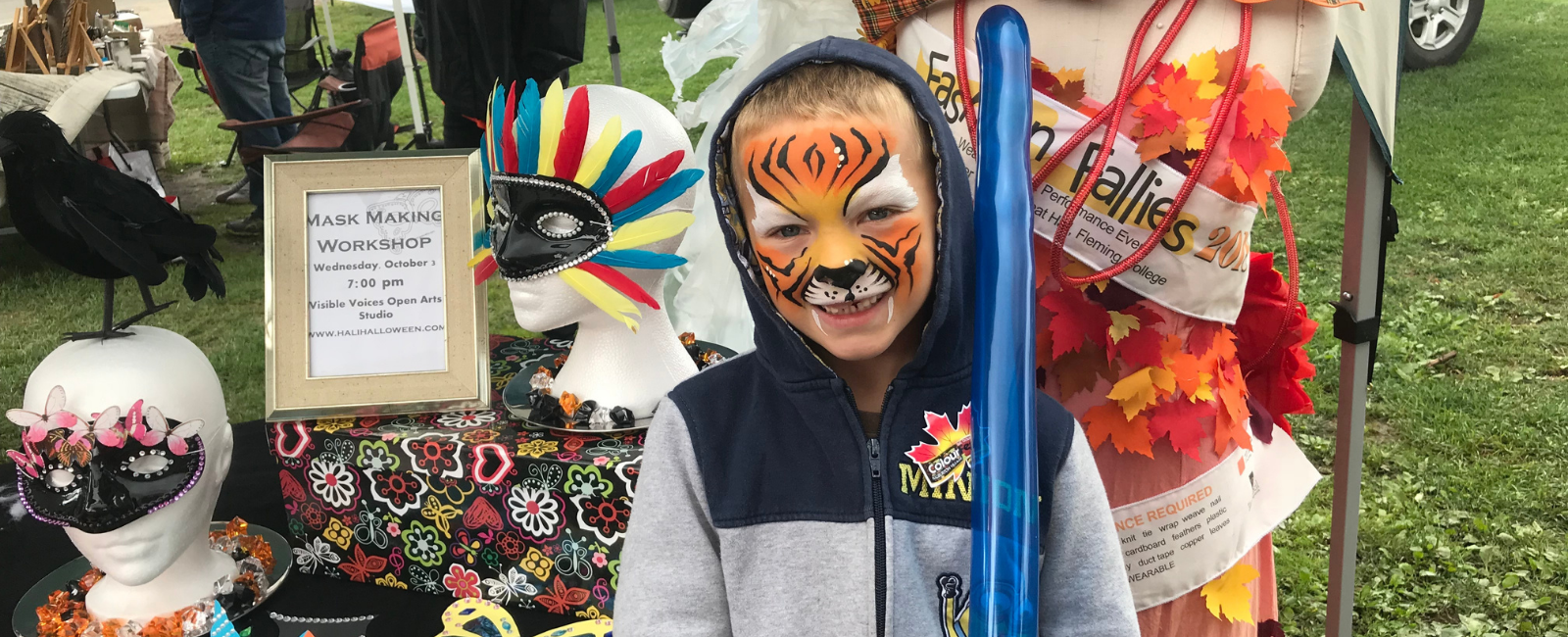 Mask display at a festival.